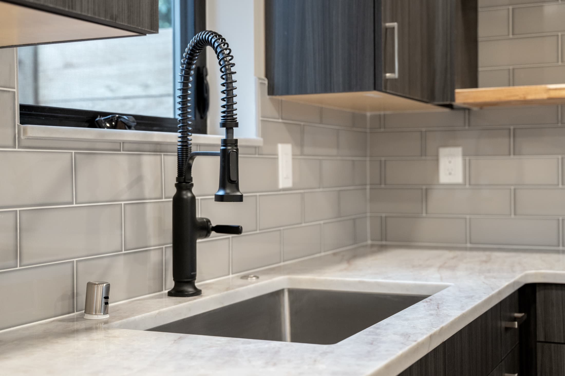 Rentable ADU kitchen with quartz counters built by DIGS Construction in the Seattle area