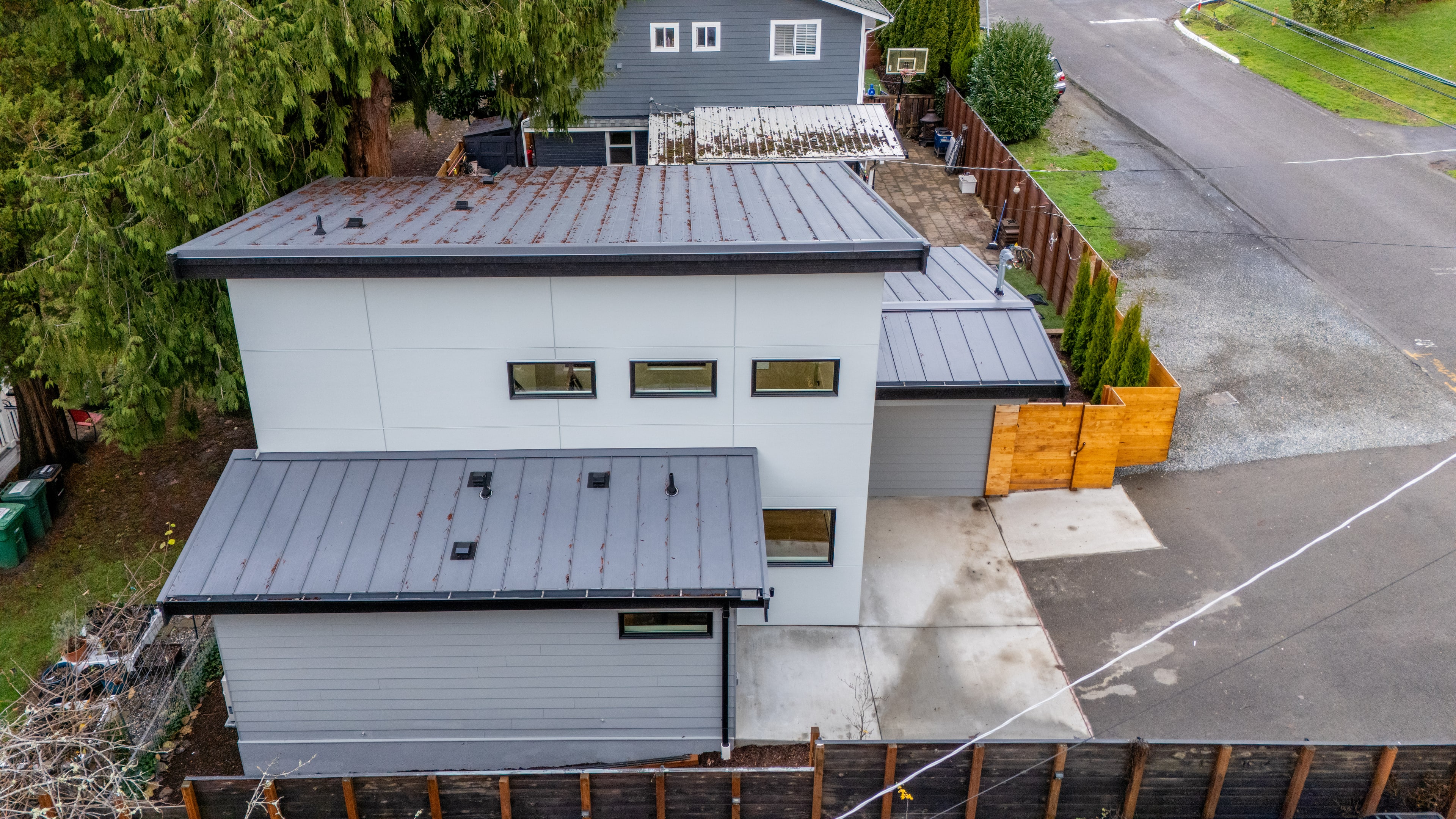 Detached ADU alongside the main house on a Seattle-area lot, built by DIGS Construction