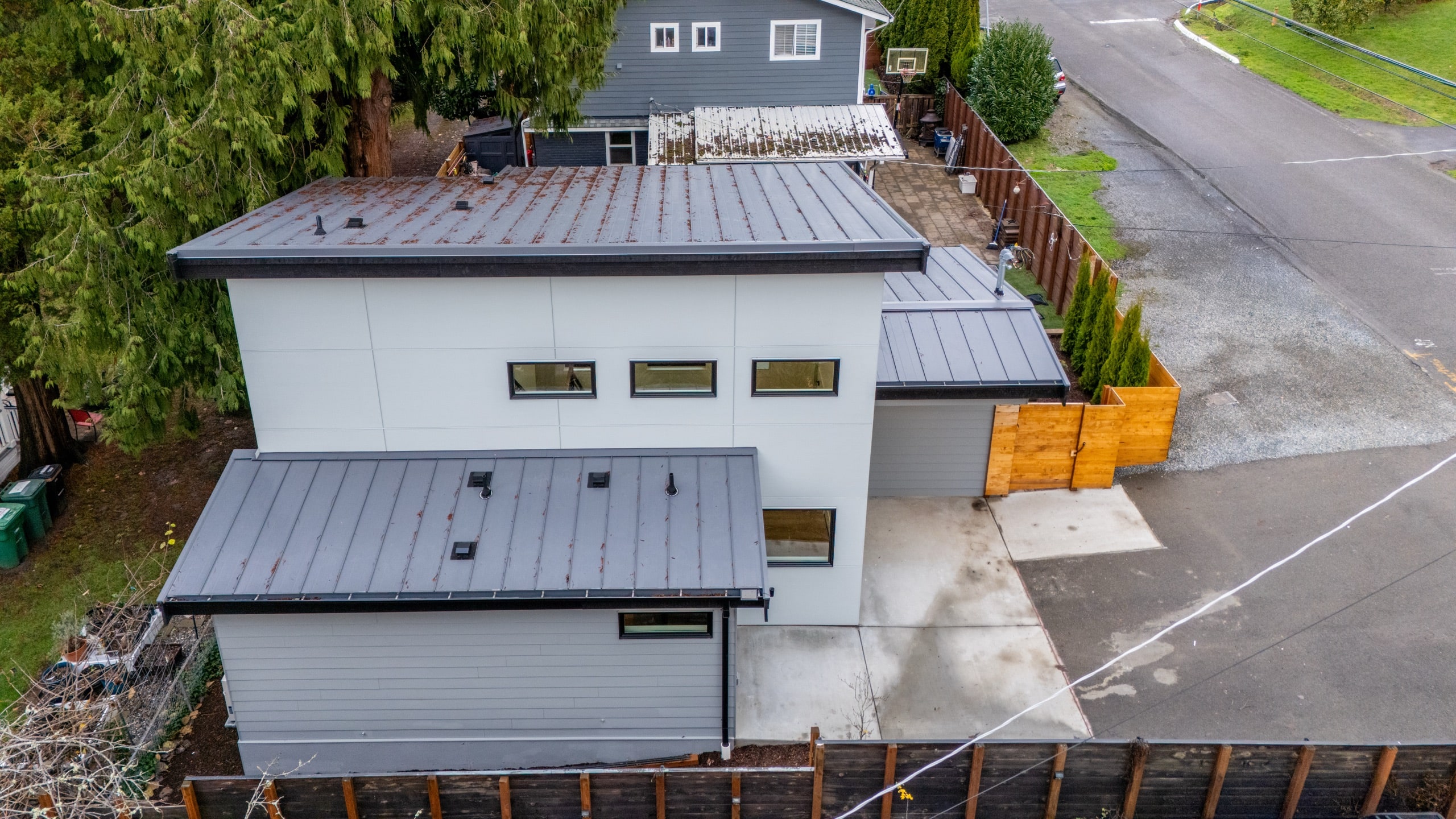 Detached ADU alongside the main house on a Seattle-area lot, built by DIGS Construction