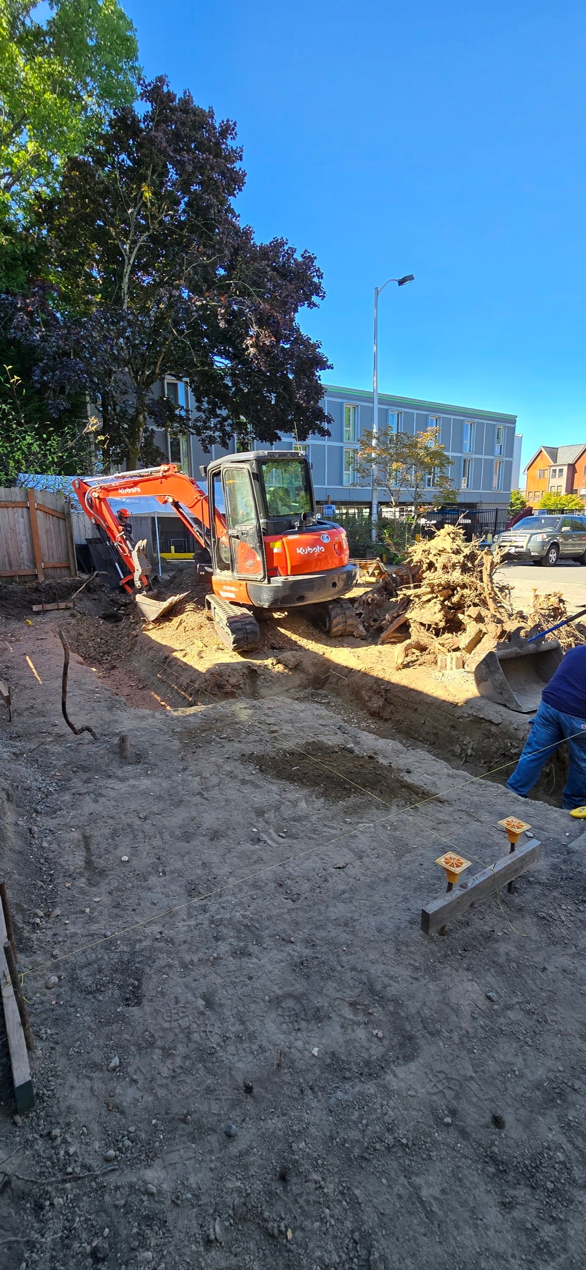 Excavation underway for the foundation of a DIGS Construction DADU on a Seattle back yard lot
