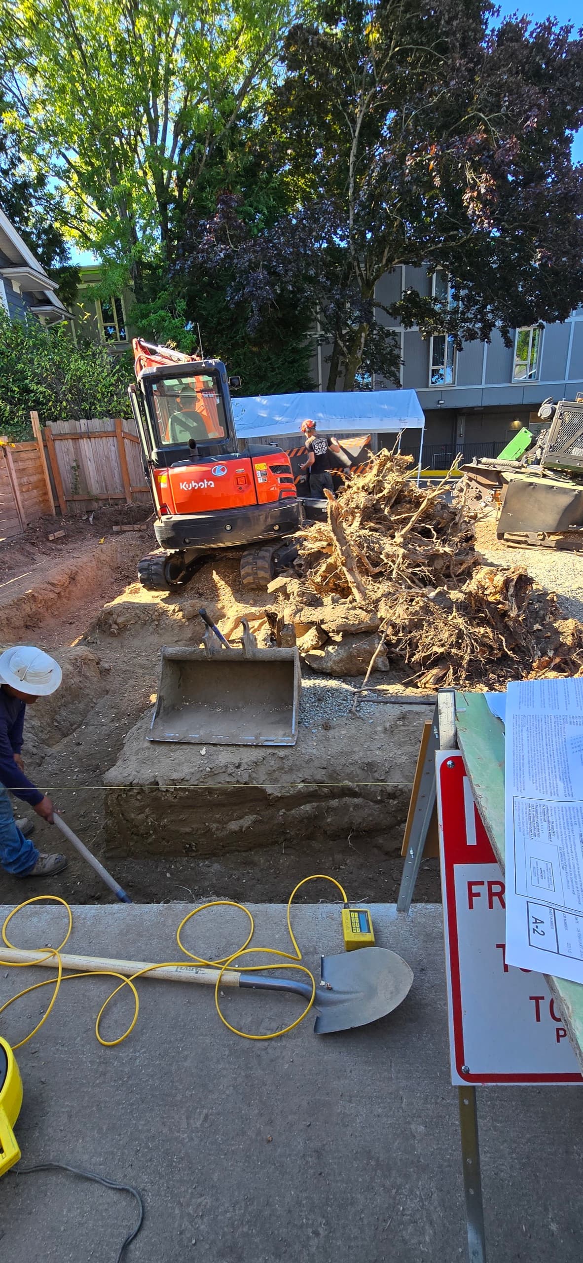 Open utility trench running to a detached ADU under construction on a DIGS Construction site