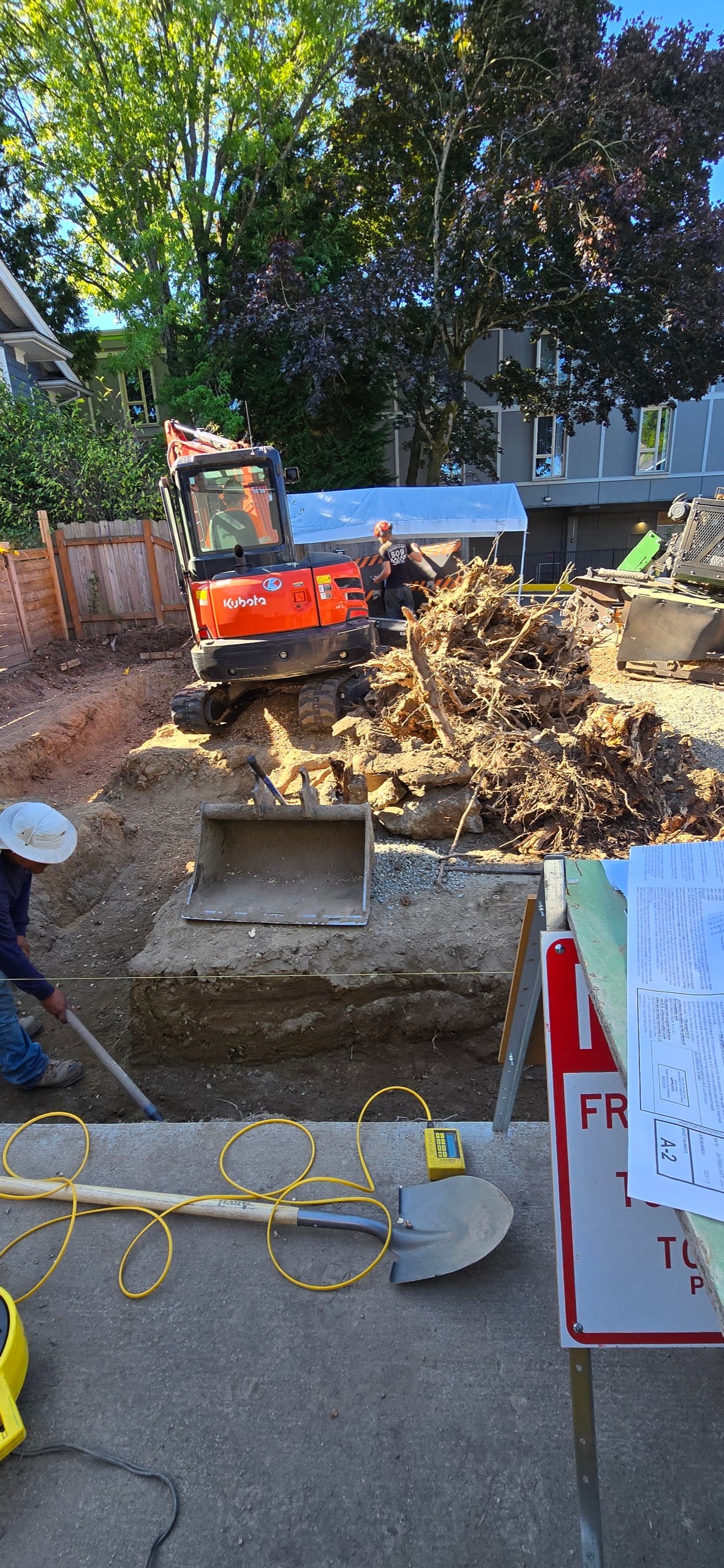 Open utility trench running to a detached ADU under construction on a DIGS Construction site