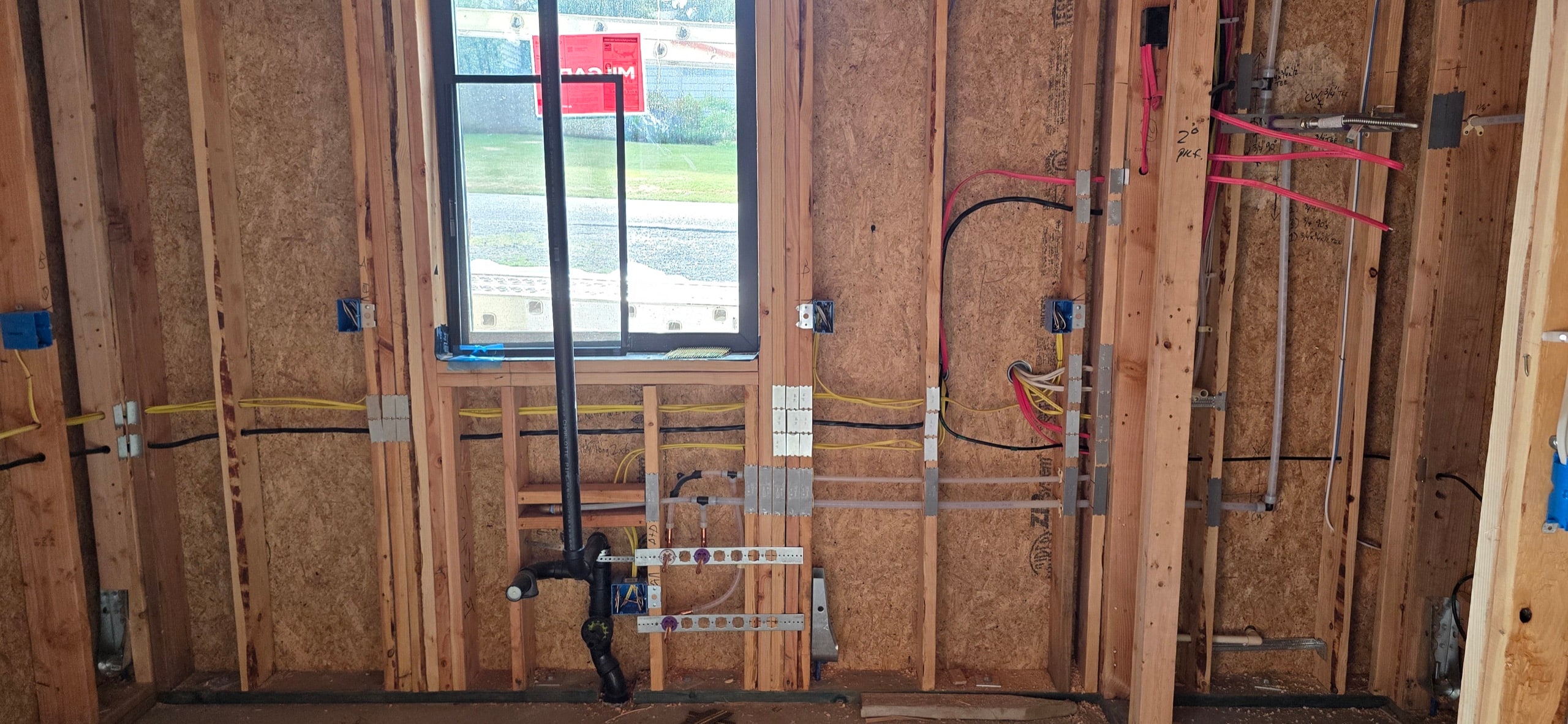 Mechanical, electrical and plumbing rough-in inside a detached accessory dwelling unit under construction near Seattle