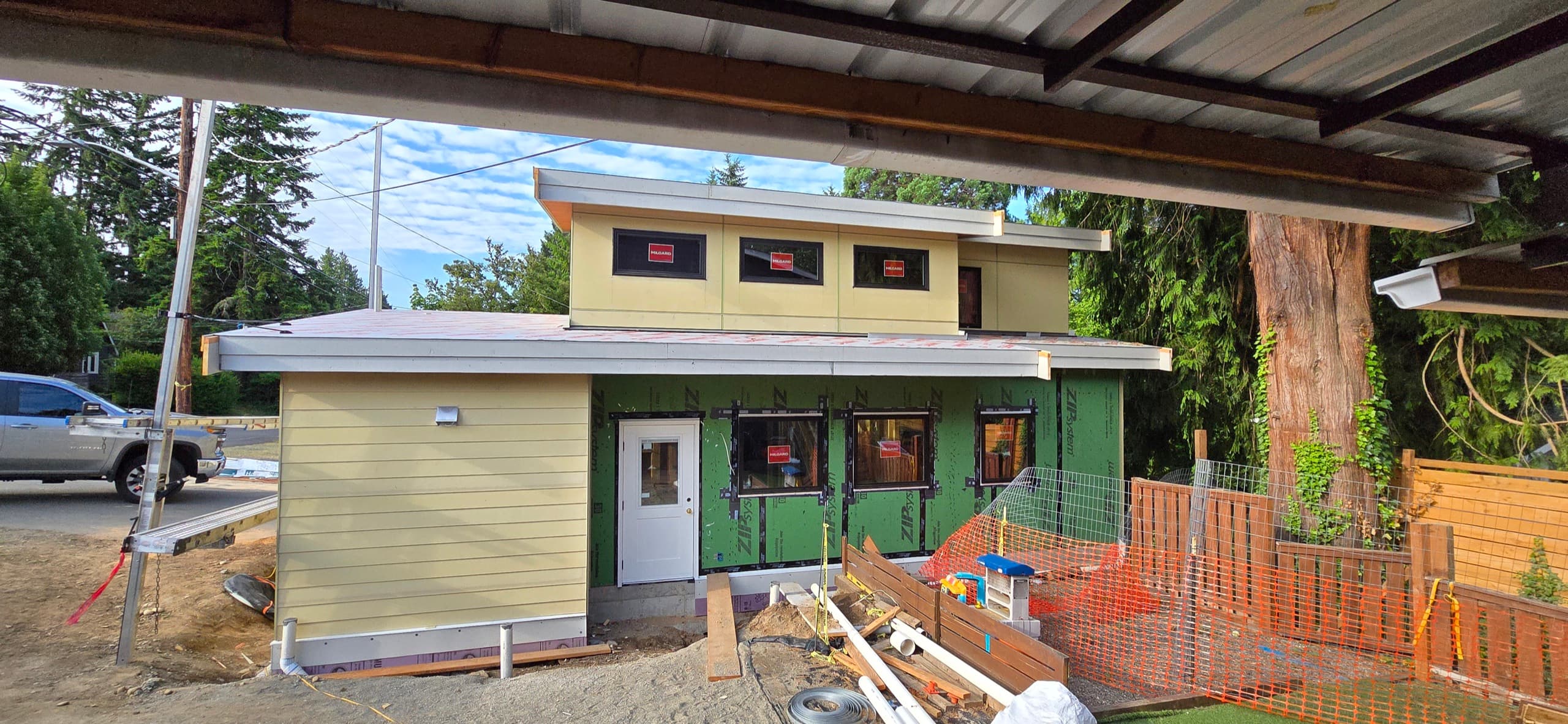 Completed detached accessory dwelling unit with painted siding built by DIGS Construction