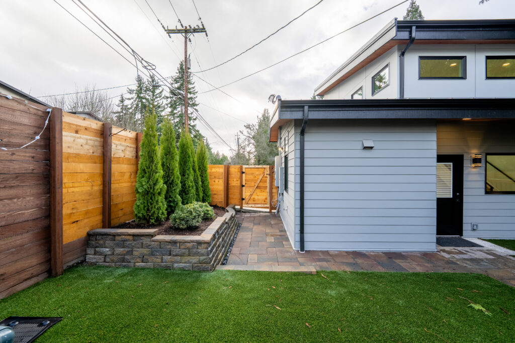 backyard fence stained house adu downspouts landscape Seattle WA